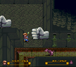 In a dungeon with Fist shaped statues.